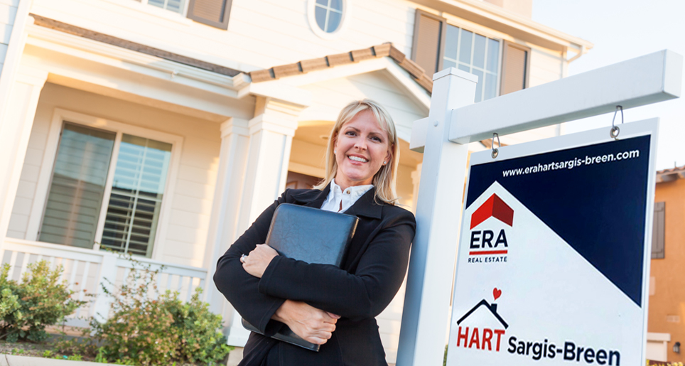 Agent in front of house for sale