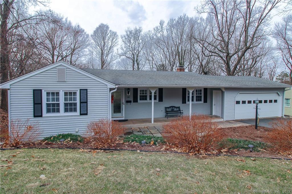 Single-story house with front porch and garage.