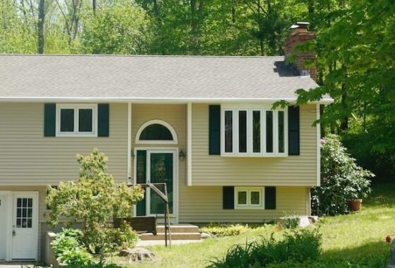 Suburban house with trees and garden.